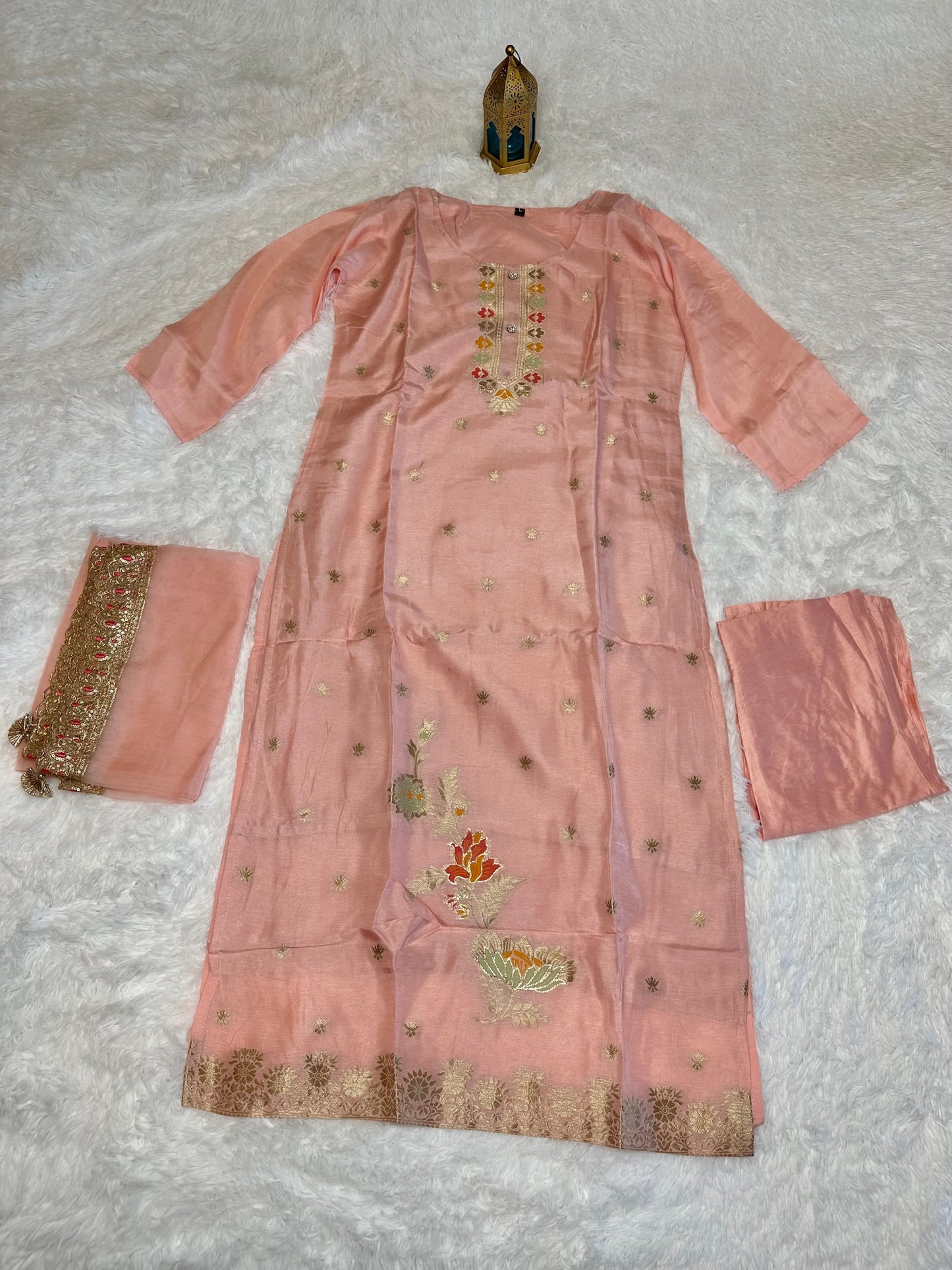 Pastel pink suit with bottom and lace work dupatta.