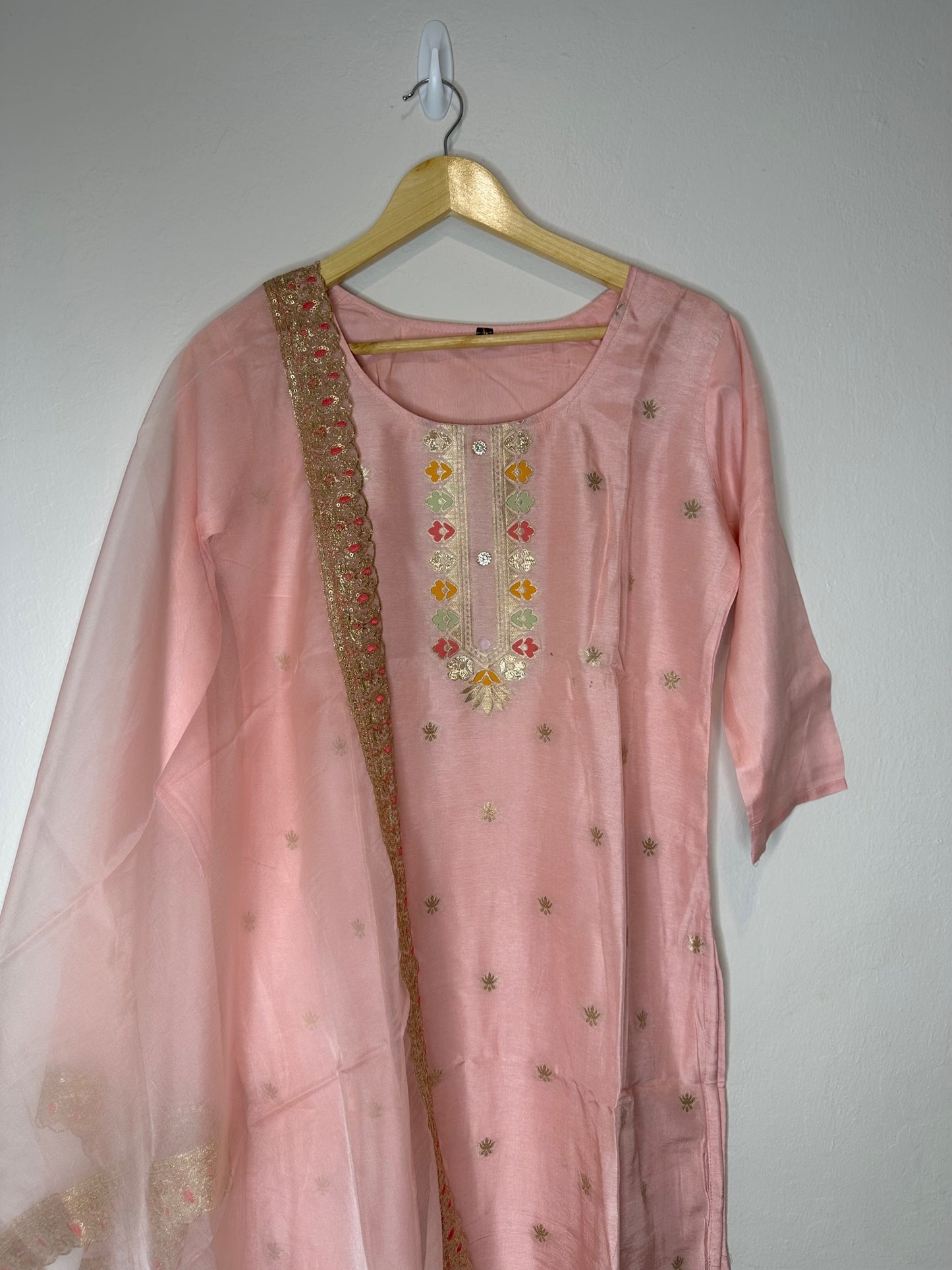 Pastel pink suit with bottom and lace work dupatta.