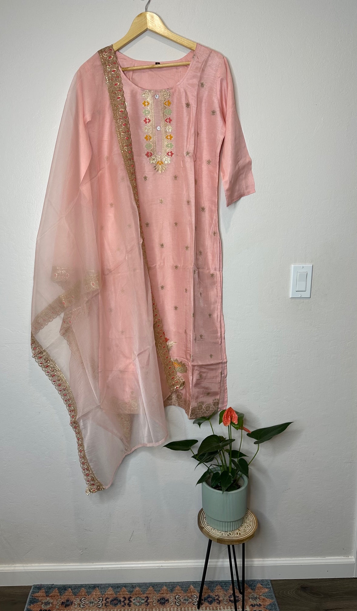 Pastel pink suit with bottom and lace work dupatta.