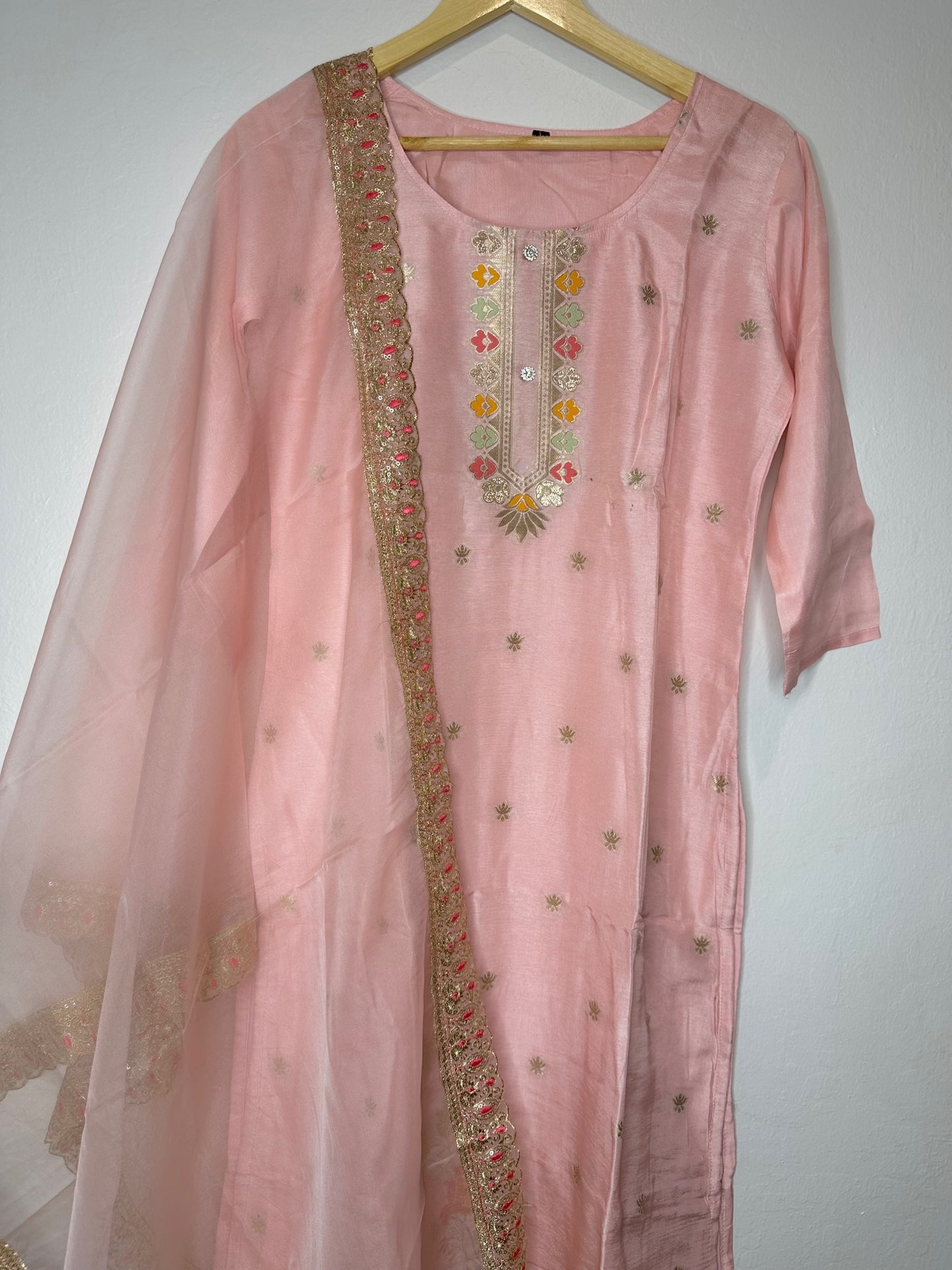 Pastel pink suit with bottom and lace work dupatta.