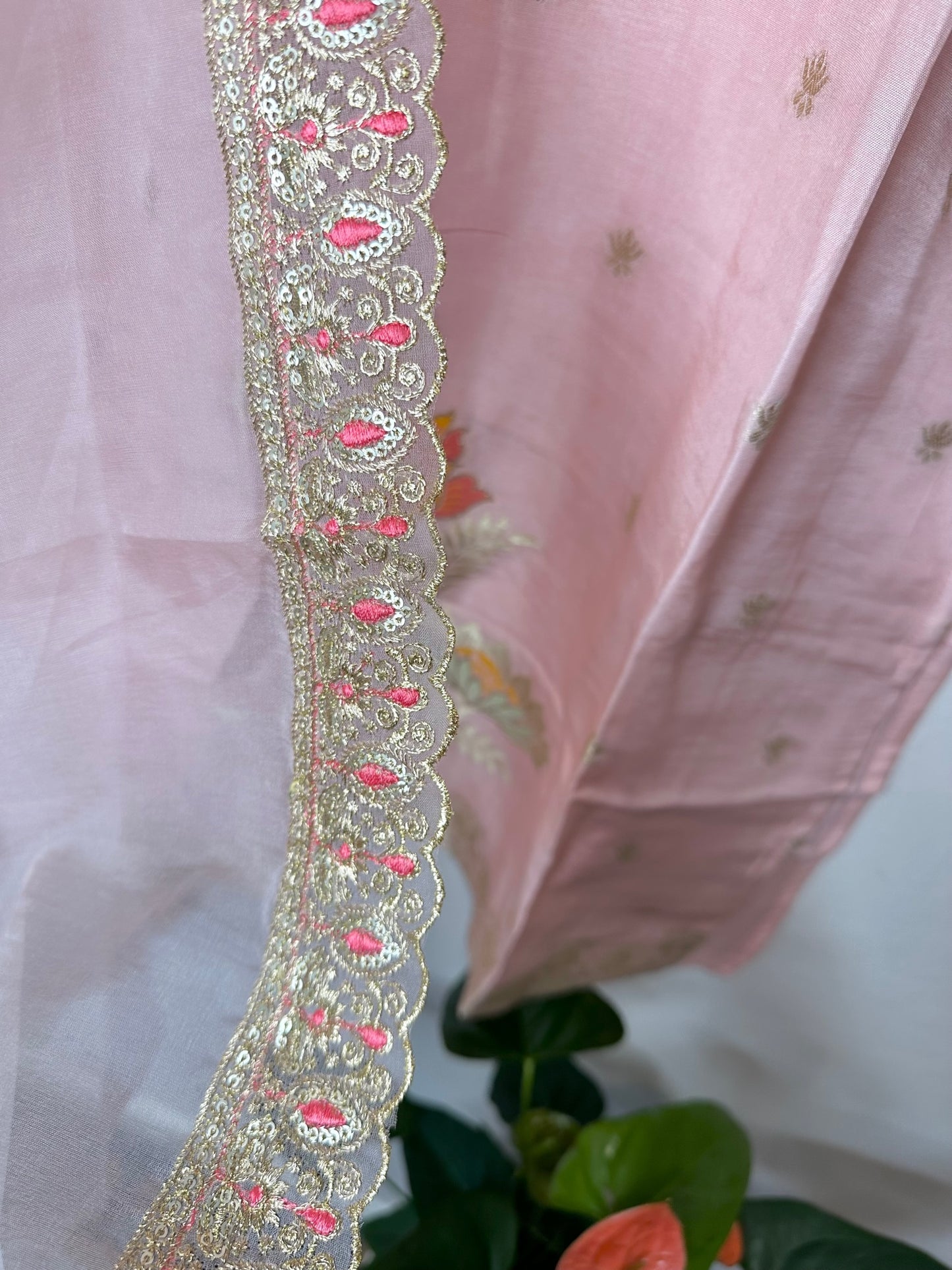 Pastel pink suit with bottom and lace work dupatta.