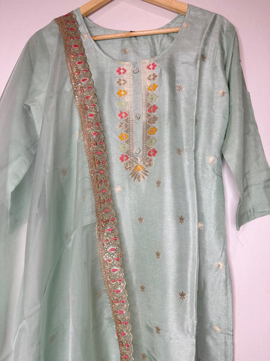 Pastel green suit with bottom and lace work dupatta.