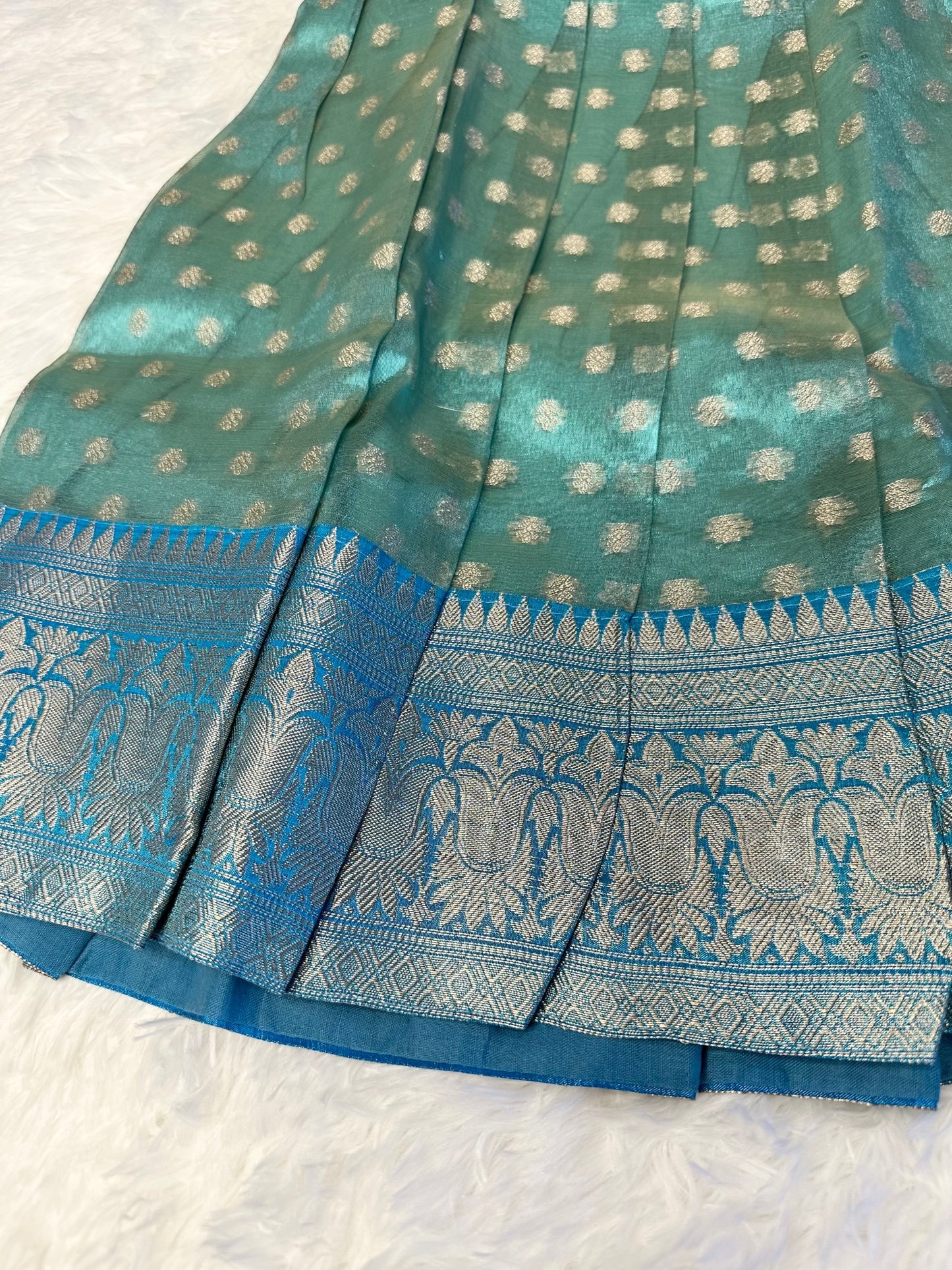 Elegant looking semi-silk lehenga(pavadai) with aari work top.