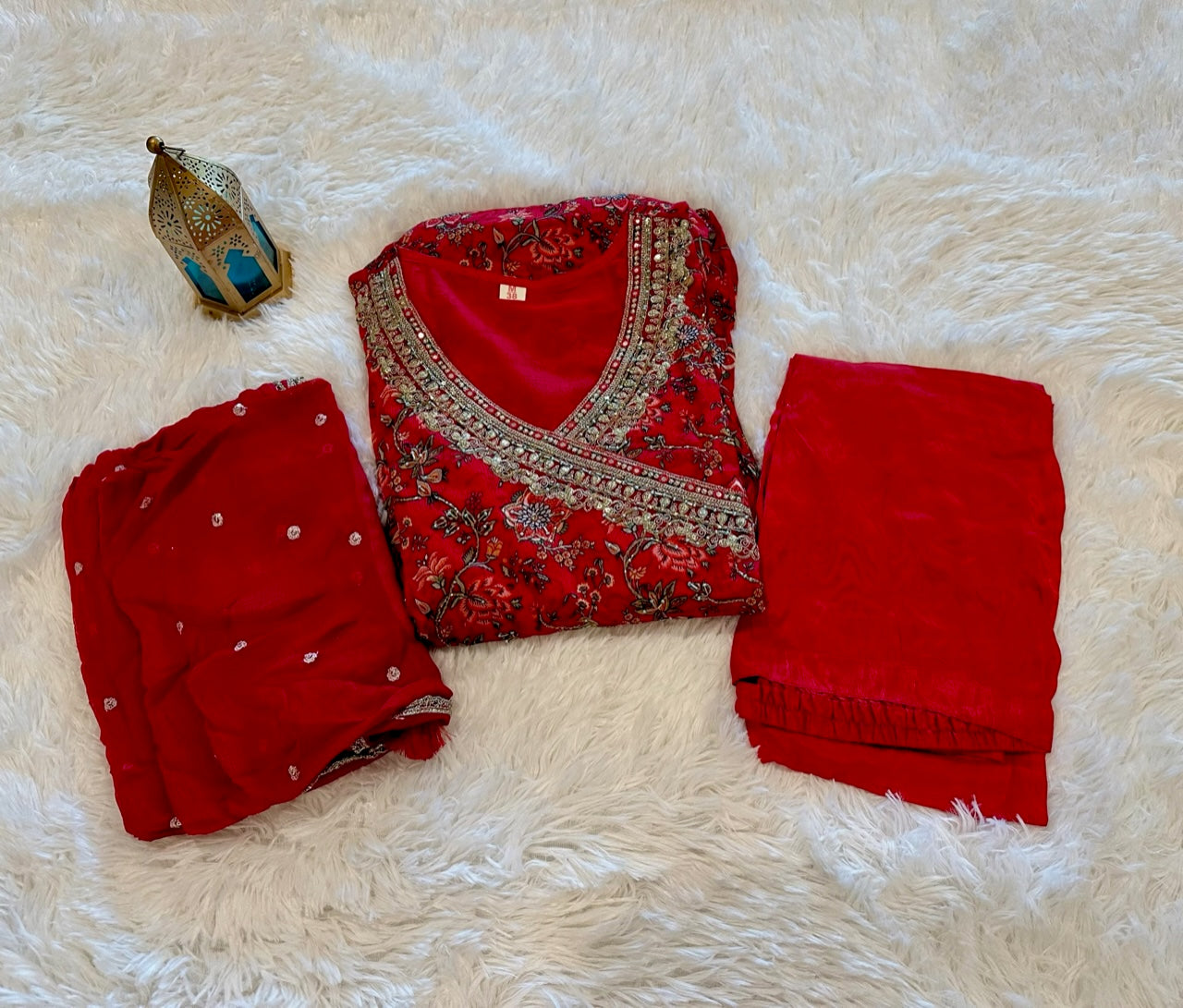 Beautiful red floral print anarkali suit with pant and dupatta.